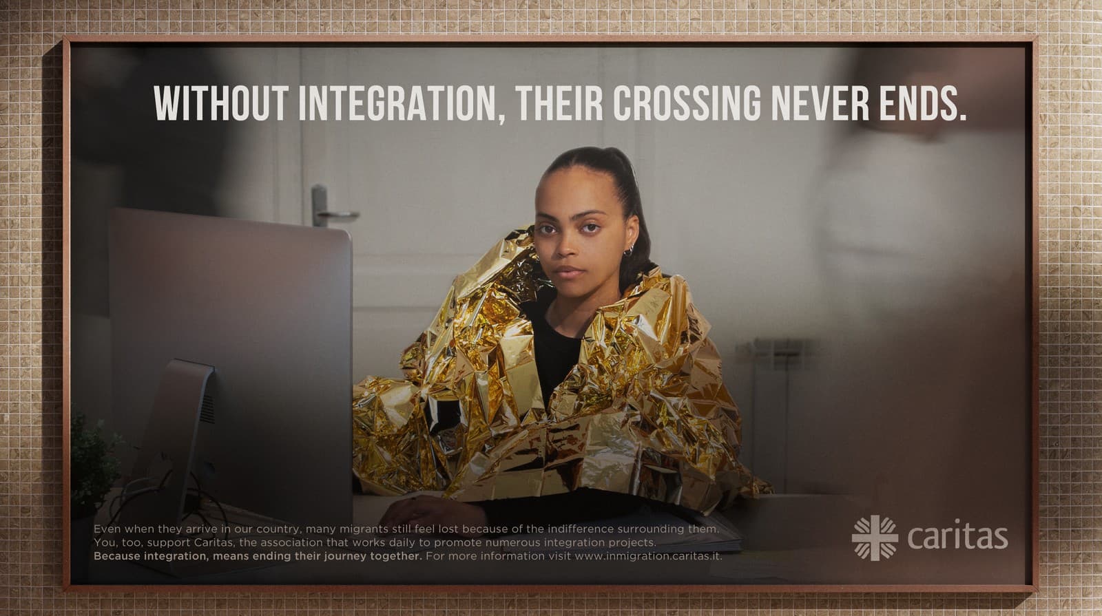 Caritas Integration billboard — migrant wrapped in a thermal blanket
